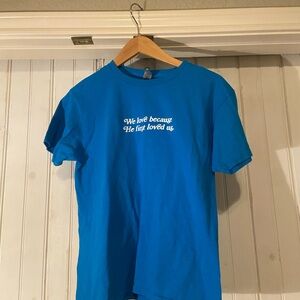 Women’s Blue Christian Tee Size YL fits like Adult S “We love because He first”